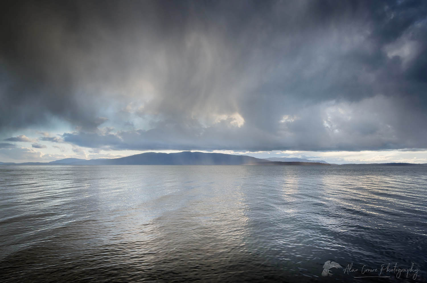 Stormy winter clouds over Bellingham Bay Washington. Lummi Island in the distance #59689