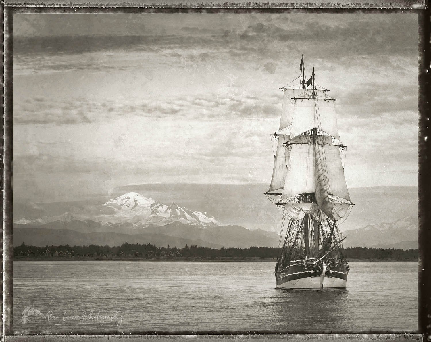 Lady Washington in Semiahmoo Bay, Washington. Mount Baker is in the distance. A historic replica of the original 18th Century brig. Owned and operated by the Grays Harbor Historical Seaport, Aberdeen, Washington #62507bwp