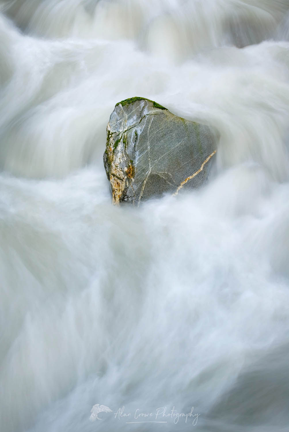 Boulder withstanding the current of Ladder Creek North Cascades Washington #16315
