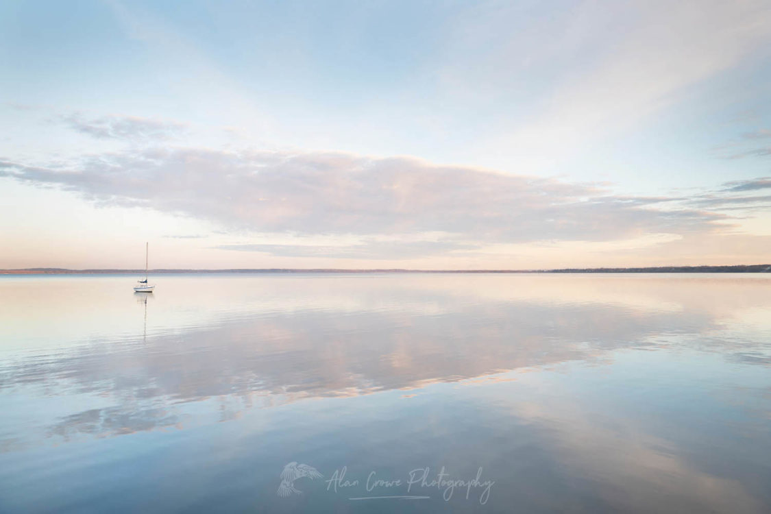 Sailboat and morning clouds refelected in calm waters of Bellingam Bay Washington #64861
