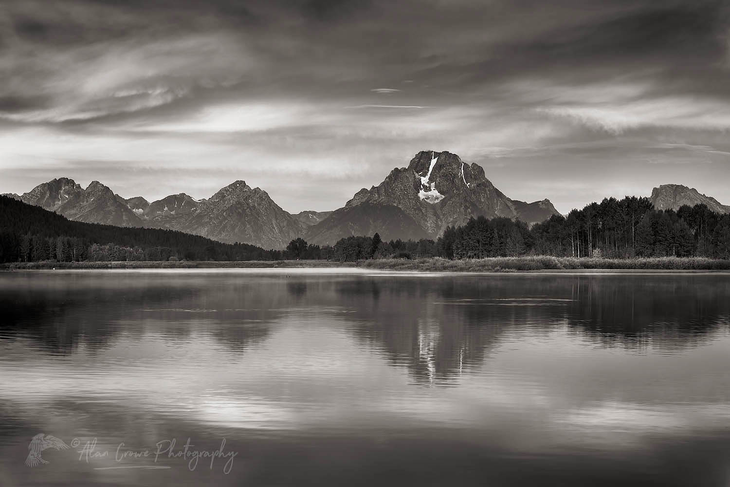 Mount Moran reflected in still waters of the Snake River at Oxbow Bend at sunrise, Grand Teton National Park Wyoming #67700bw