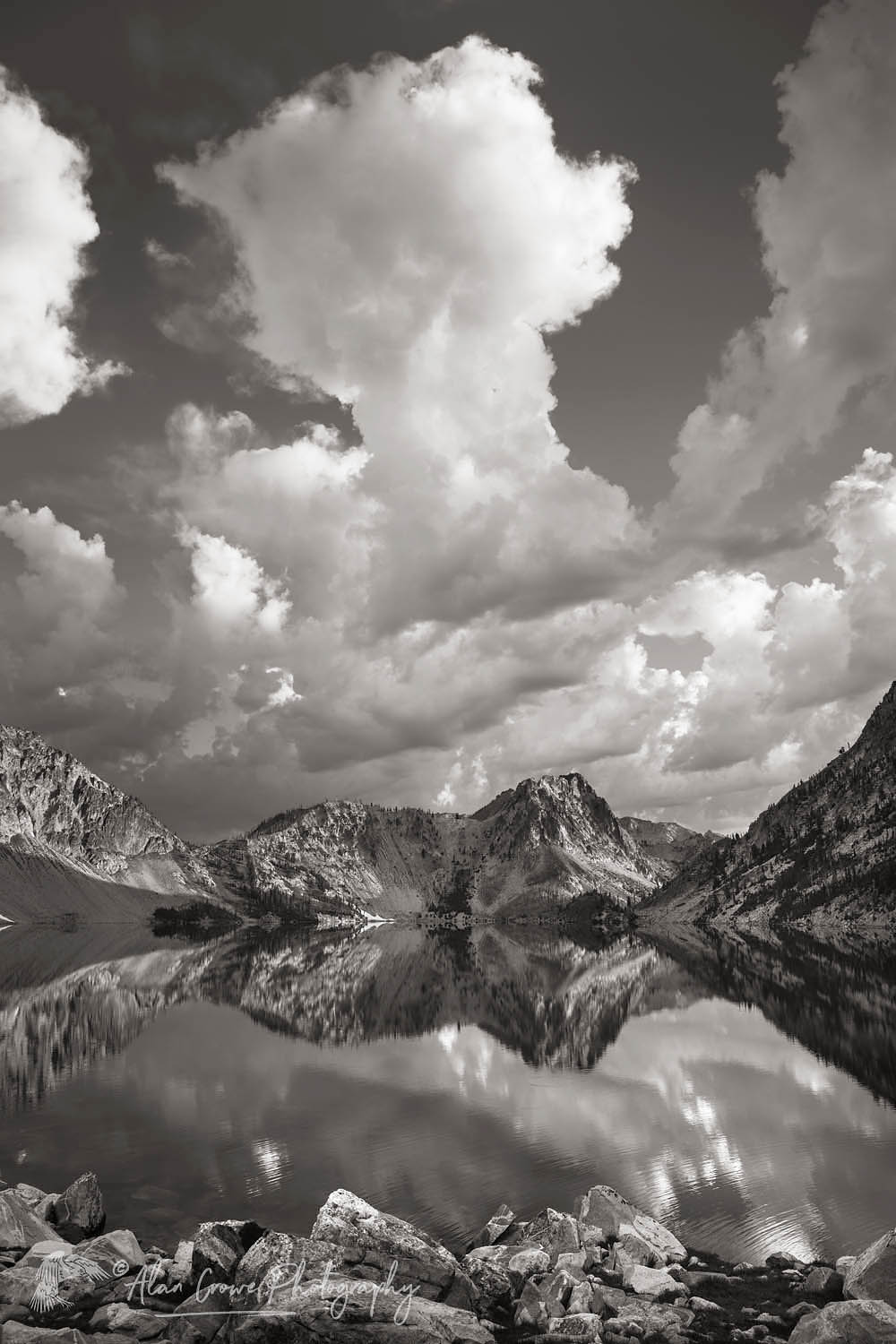 Morning clouds mirrored in still waters of Sawtooth Lake. Sawtooth Mountains Wilderness Idaho #65974bw
