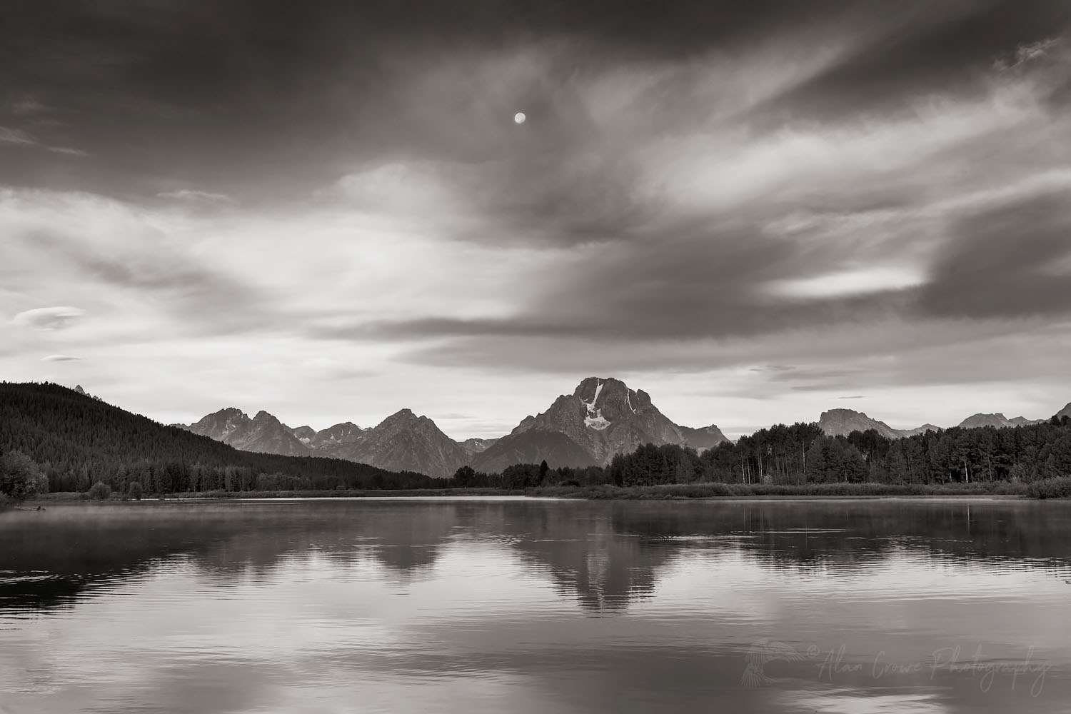Full moon and Mount Moran reflected in still waters of the Snake River at Oxbow Bend at sunrise, Grand Teton National Park Wyoming #67731bw