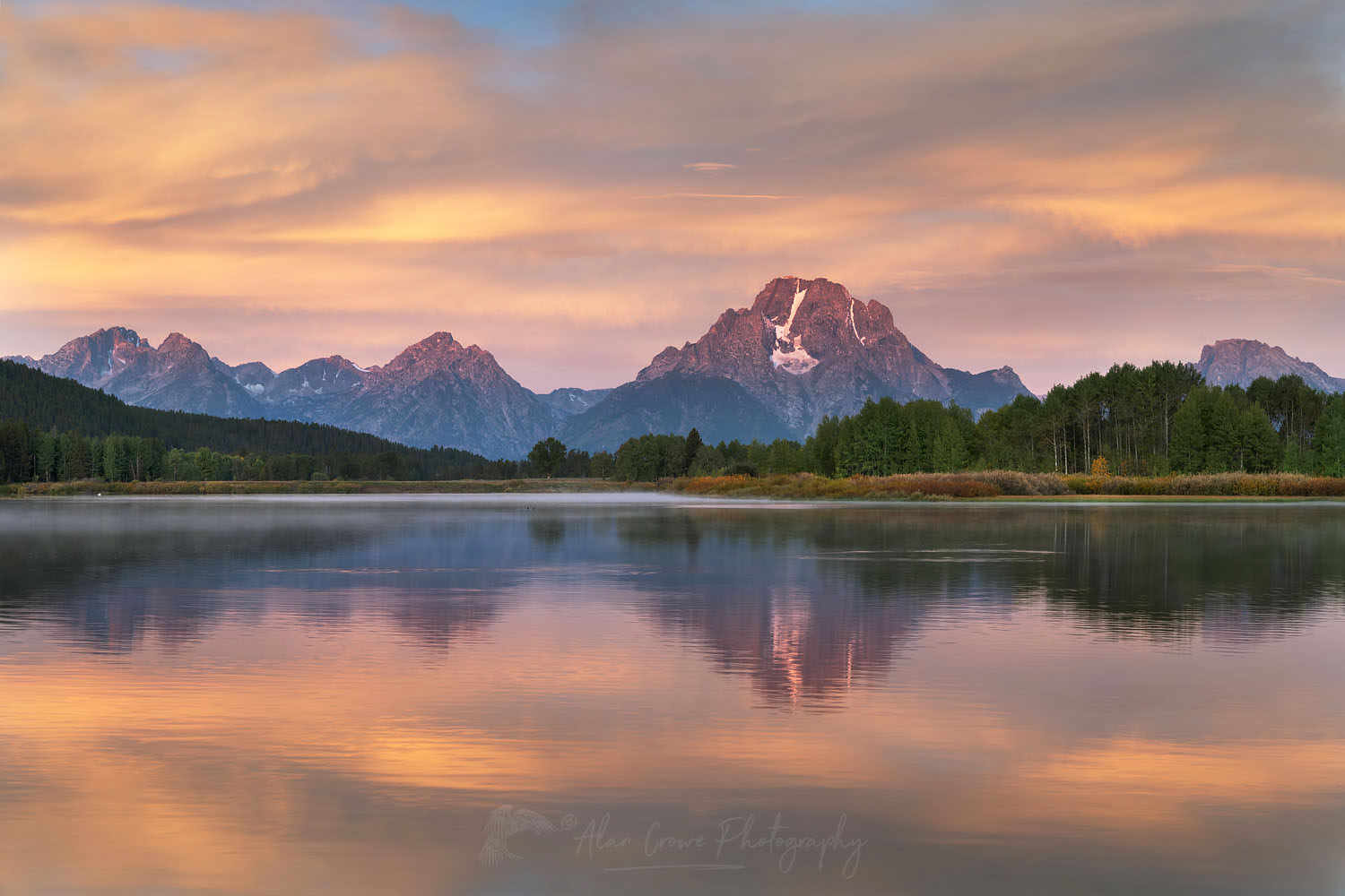 Mount Moran reflected in still waters of the Snake River at Oxbow Bend at sunrise, Grand Teton National Park Wyoming #67700
