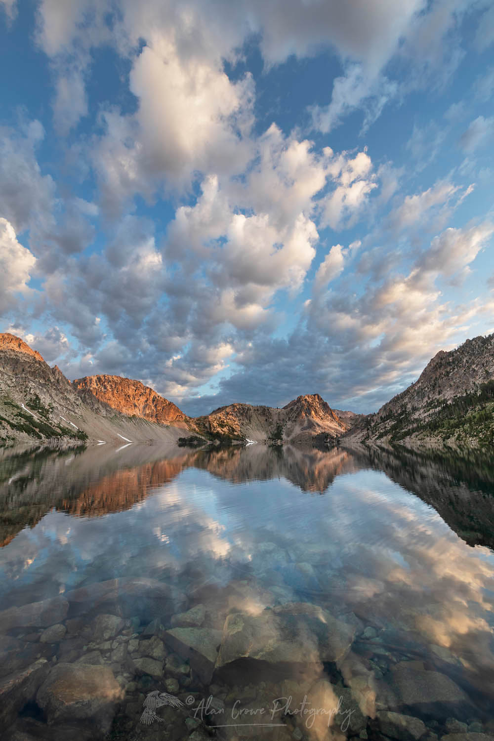 Morning clouds mirrored in still waters of Sawtooth Lake. Sawtooth Mountains Wilderness Idaho #65958