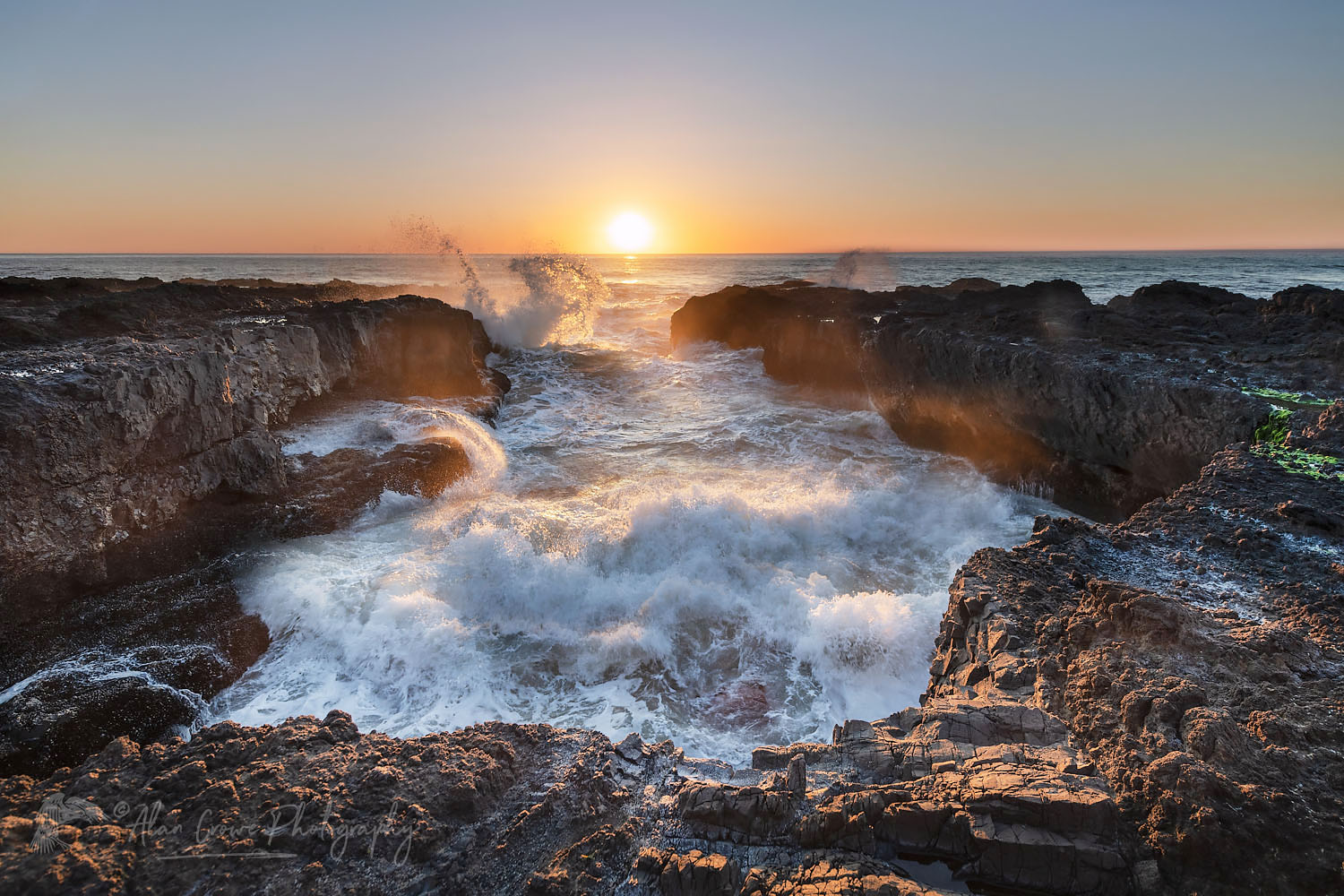 Waves crashing though lava headlands during sunset at Cape Perpetua Oregon #71095