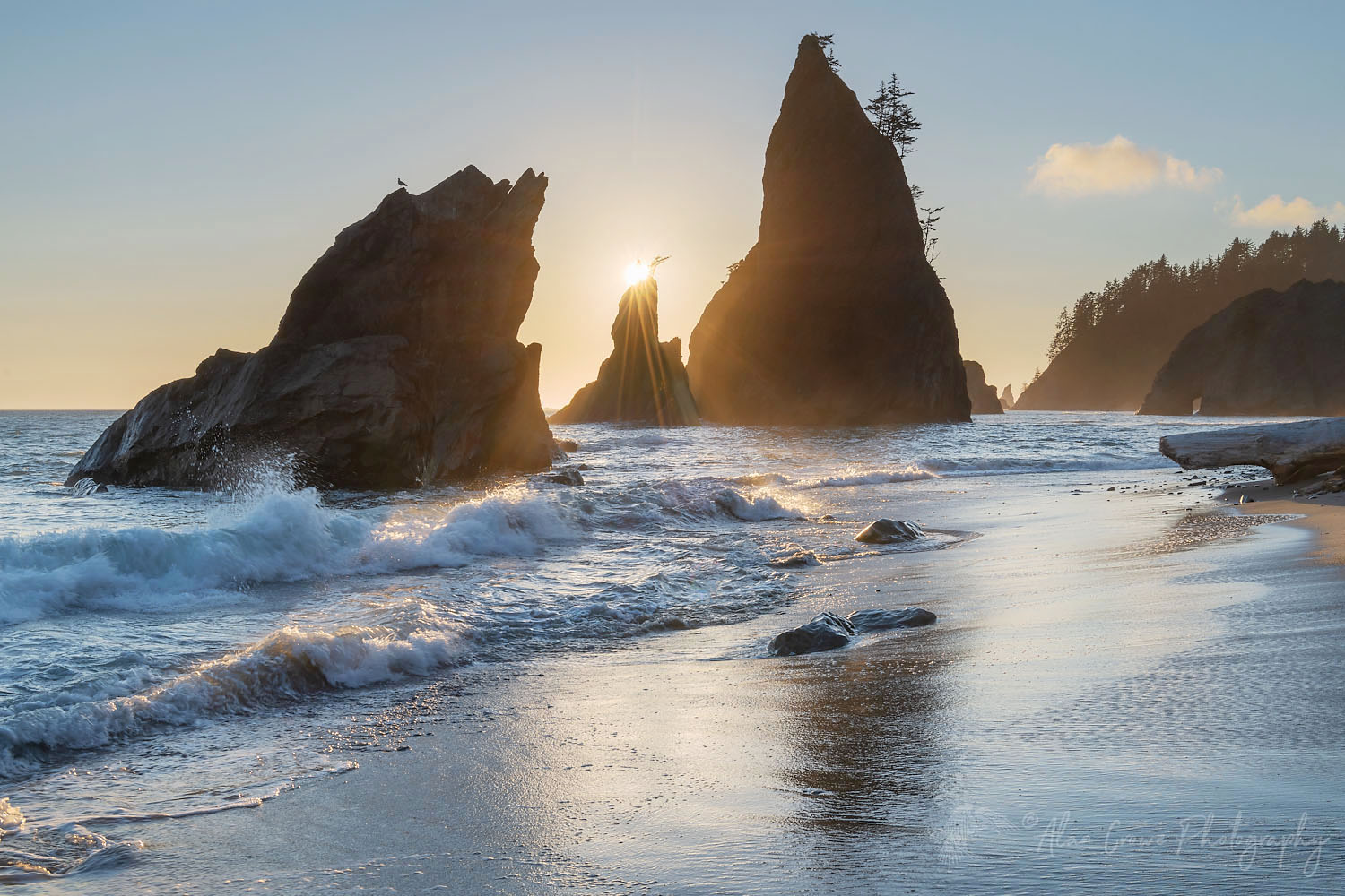 Sun setting behind Split Rock on Rialto Beach Olympic National Park Washington #71930