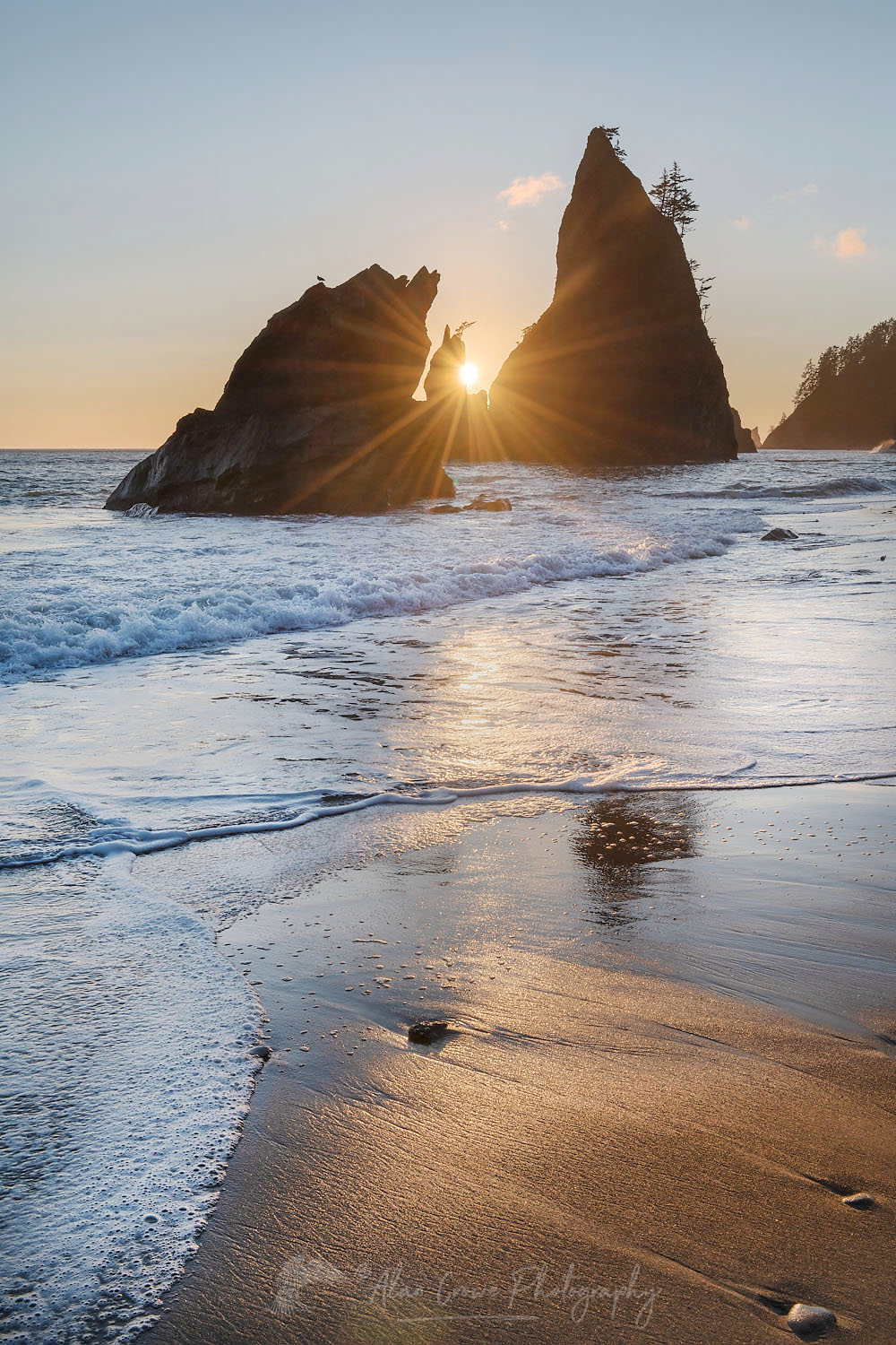 Sun setting behind Split Rock on Rialto Beach Olympic National Park Washington #71951