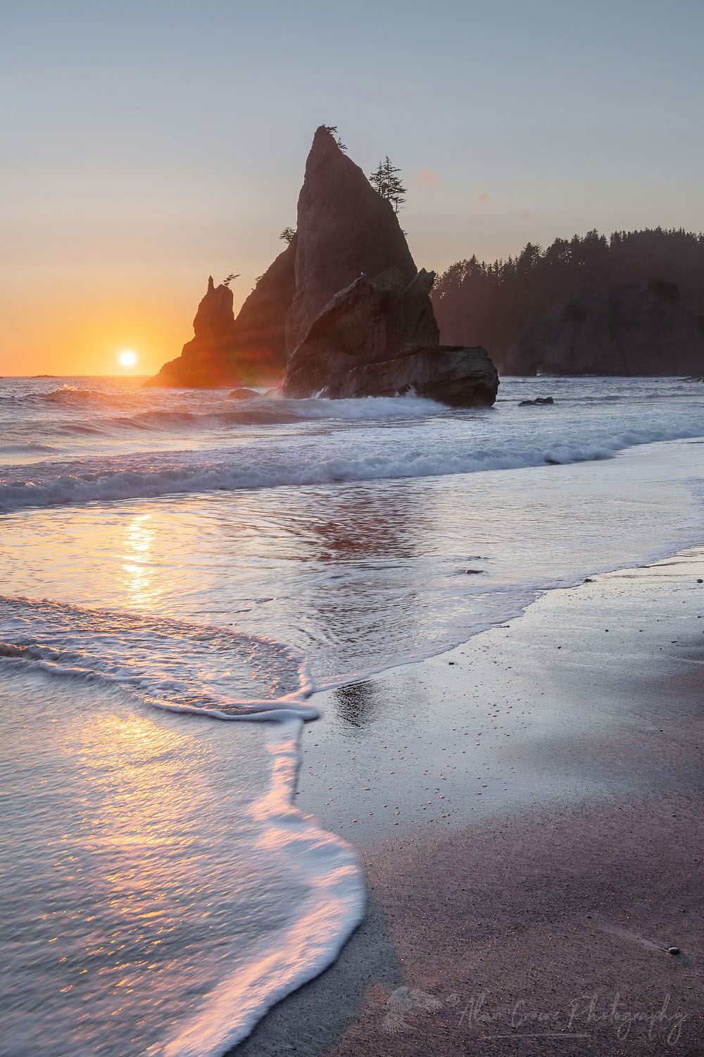 Sun setting behind Split Rock on Rialto Beach Olympic National Park Washington #71988