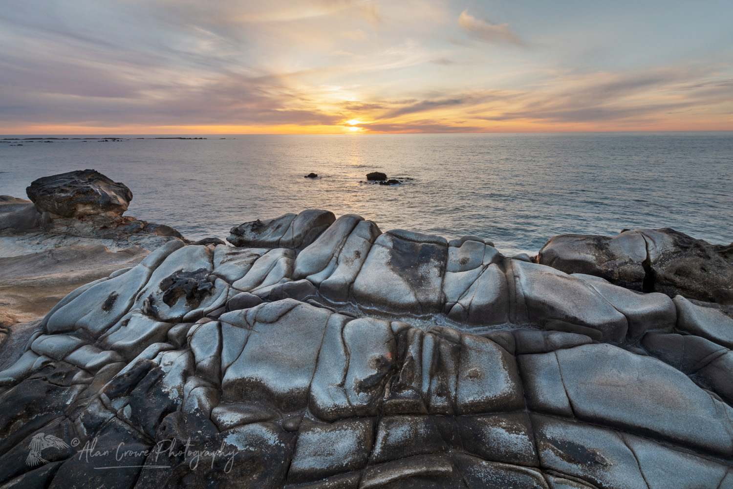 Sunset over Mineral concretions on cliffs of Shore Acres State Park Oregon #83005