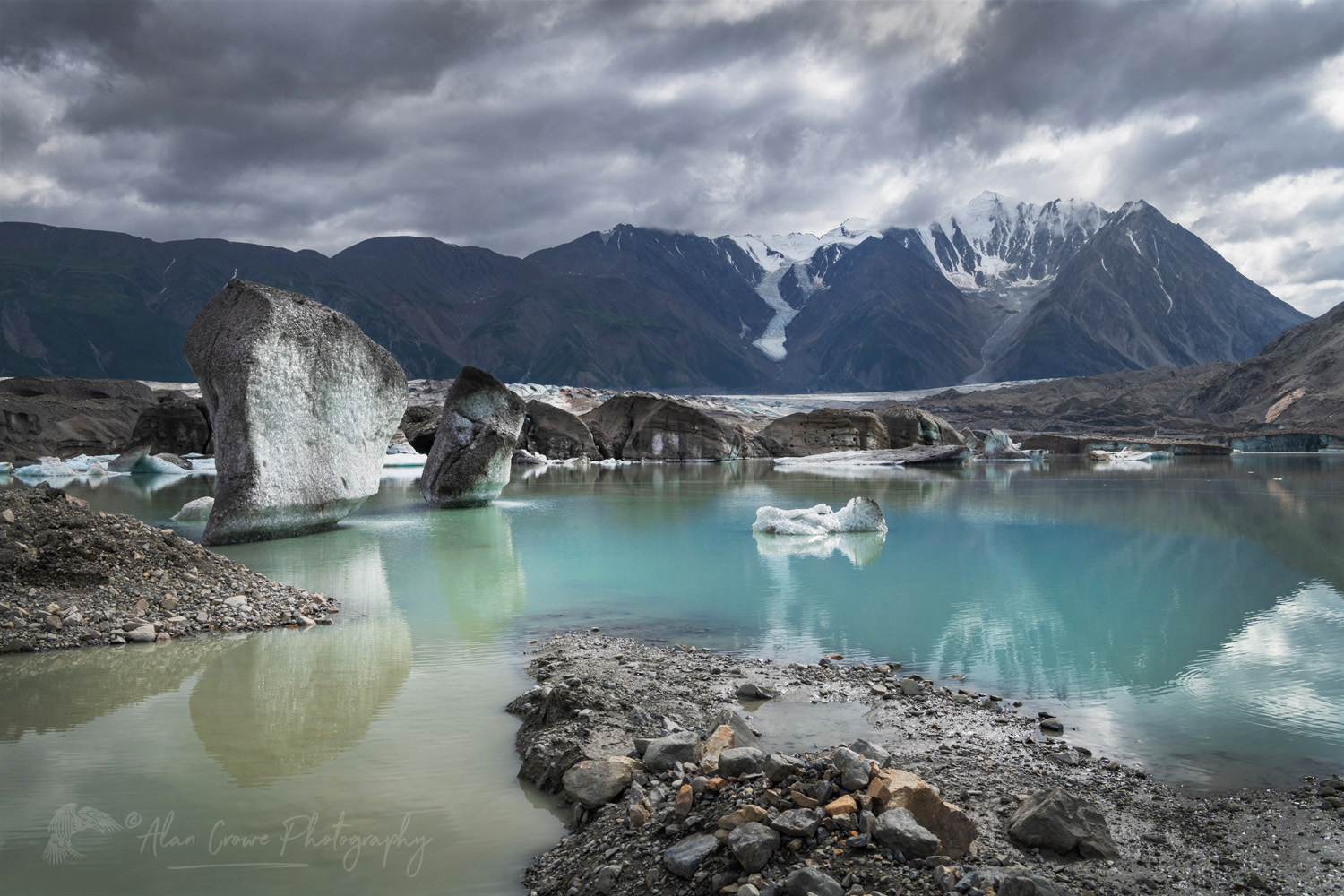Icebergs stranded on debris at the ice-marginal lake of Kaskawulsh Glacier. Ä’äy Chù (Slim's River) West, Kluane National Park, Yukon #86720
